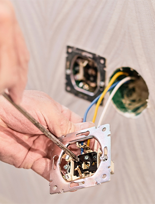 Electrician working on electrical panel at KA Talarico Electric LLC home services.
